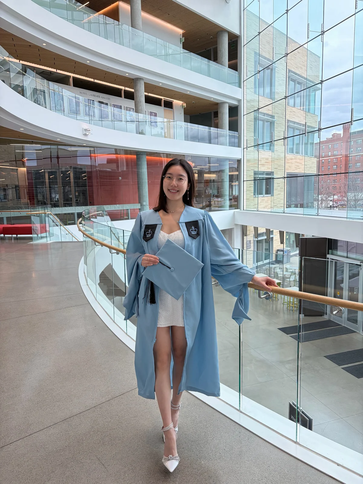 Xiao Yang wearing a light blue graduation gown